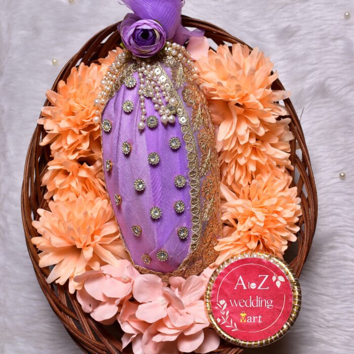 Beautifully decorated Shagun Nariyal featuring vibrant red fabric and intricate gold lace for weddings