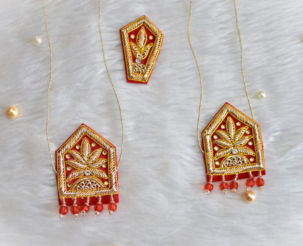 Close-up of intricate hand-crafted Zardozi embroidery on a small Groom Sevra
